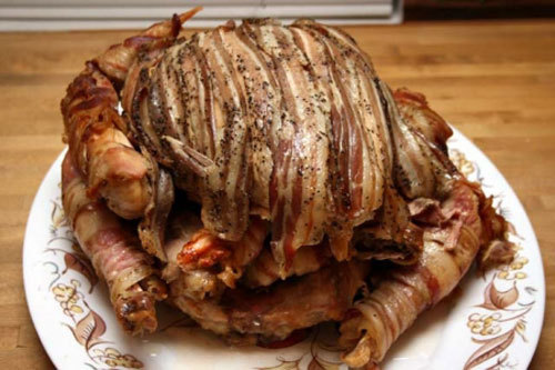 Turbaconucken A chicken inside a duck inside a turkey, all wrapped in bacon. (via nycfoodguy)