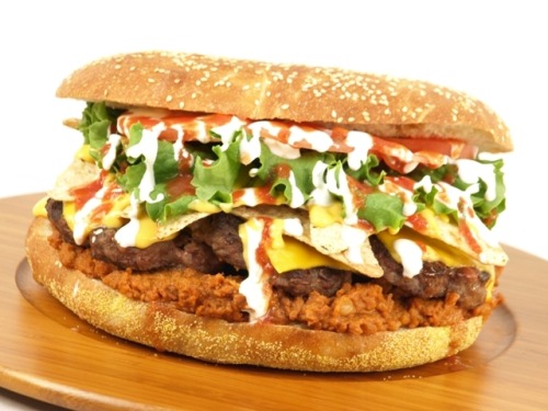 The Fifth Third Burger A 5/3 of a pound beef patty with lettuce, tomato, salsa, sour cream, chili and Fritos on an eight-inch sesame seed bun. (via CNBC)